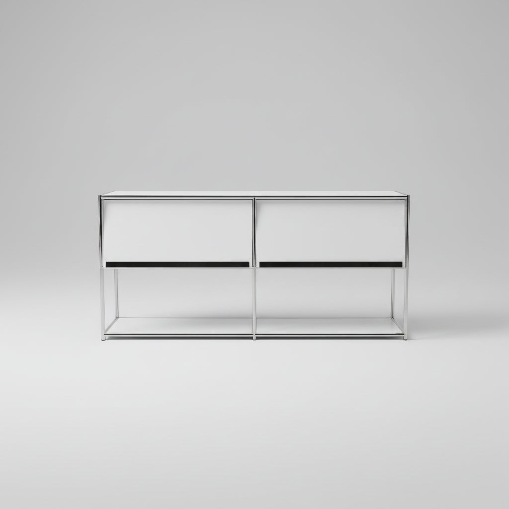 Metallic sculpture on a grassy area with trees and sky in the background