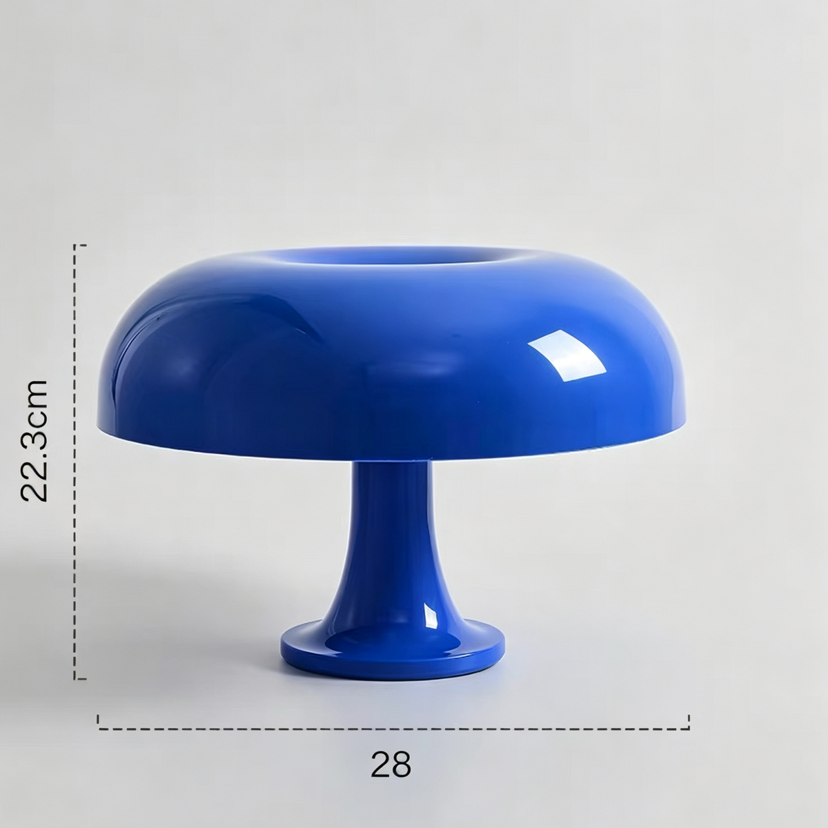 A glossy cobalt blue pedestal lamp or decorative table lamp with a rounded dome-shaped shade and a flared base, shown on a light gray background with dimension markings indicating 22.3 cm height and 28 cm width.