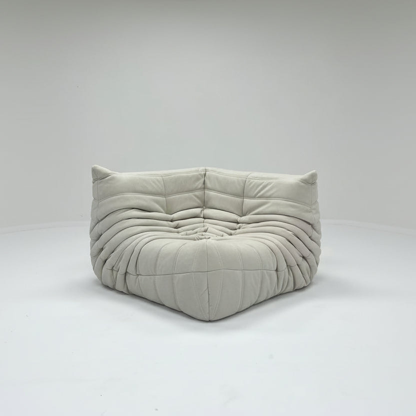 Gray cushioned sofa on a white background