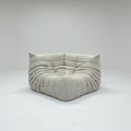 Gray cushioned sofa on a white background