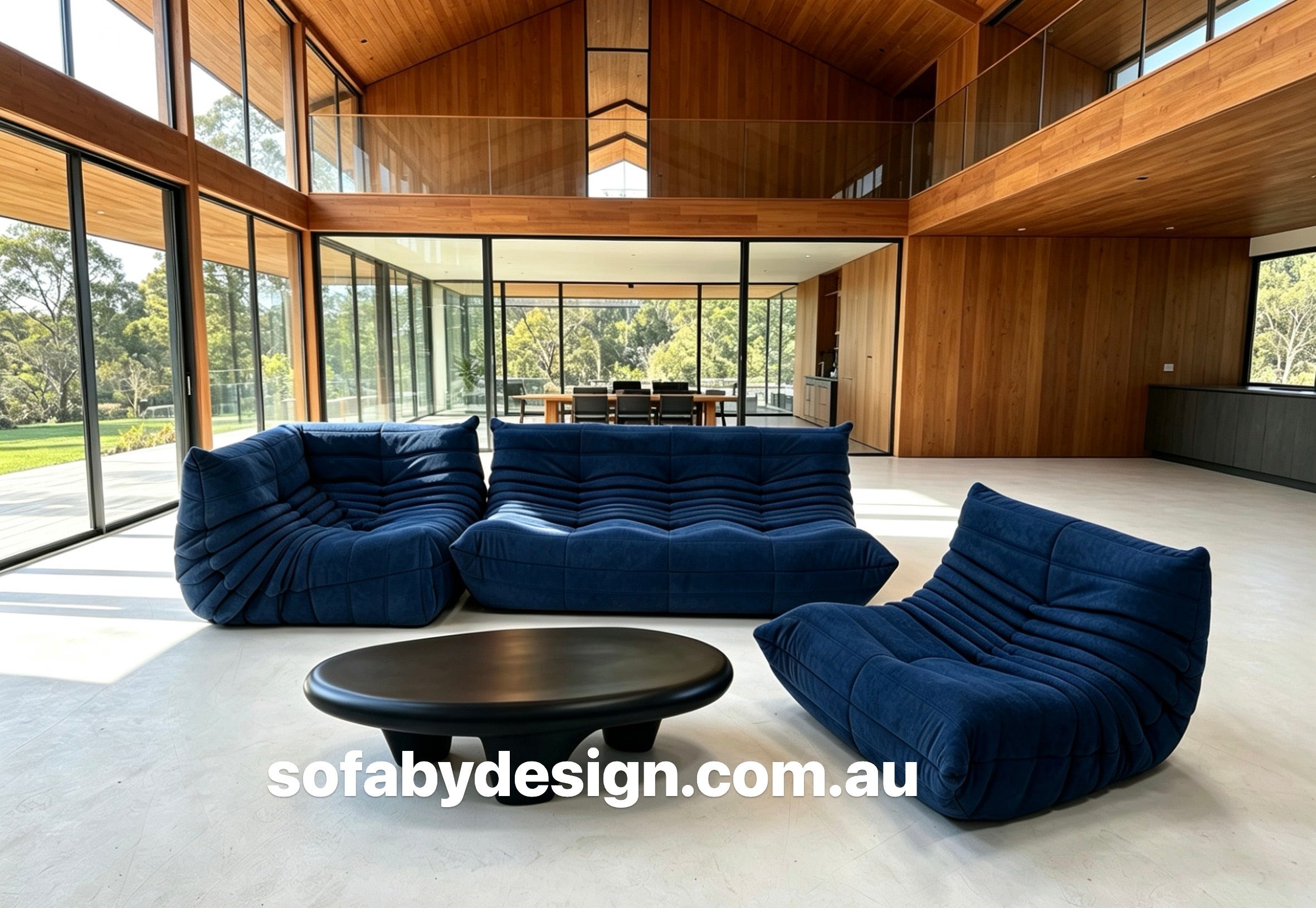 Royal blue three seater lounge in a contemporary interior