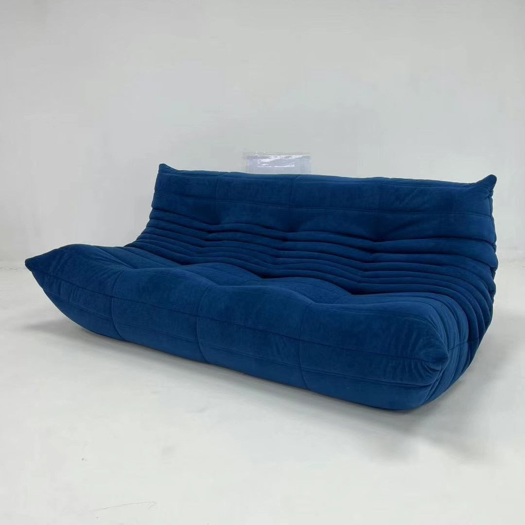 Royal blue vegan suede three seater sofa angled view