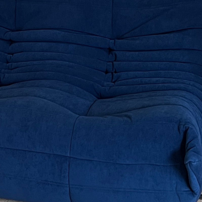Close-up of royal blue vegan suede upholstery and cushioning