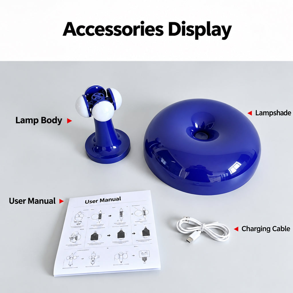 Product accessories displayed on a light gray background under the heading 'Accessories Display'. The set includes a blue and white adjustable lamp body, a glossy blue dome-shaped lampshade, a white charging cable, and a printed user manual with diagrams.