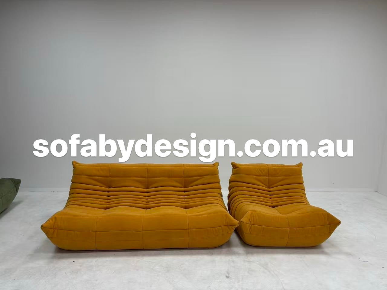 Yellow Togo-inspired sofa collection in a modern living space