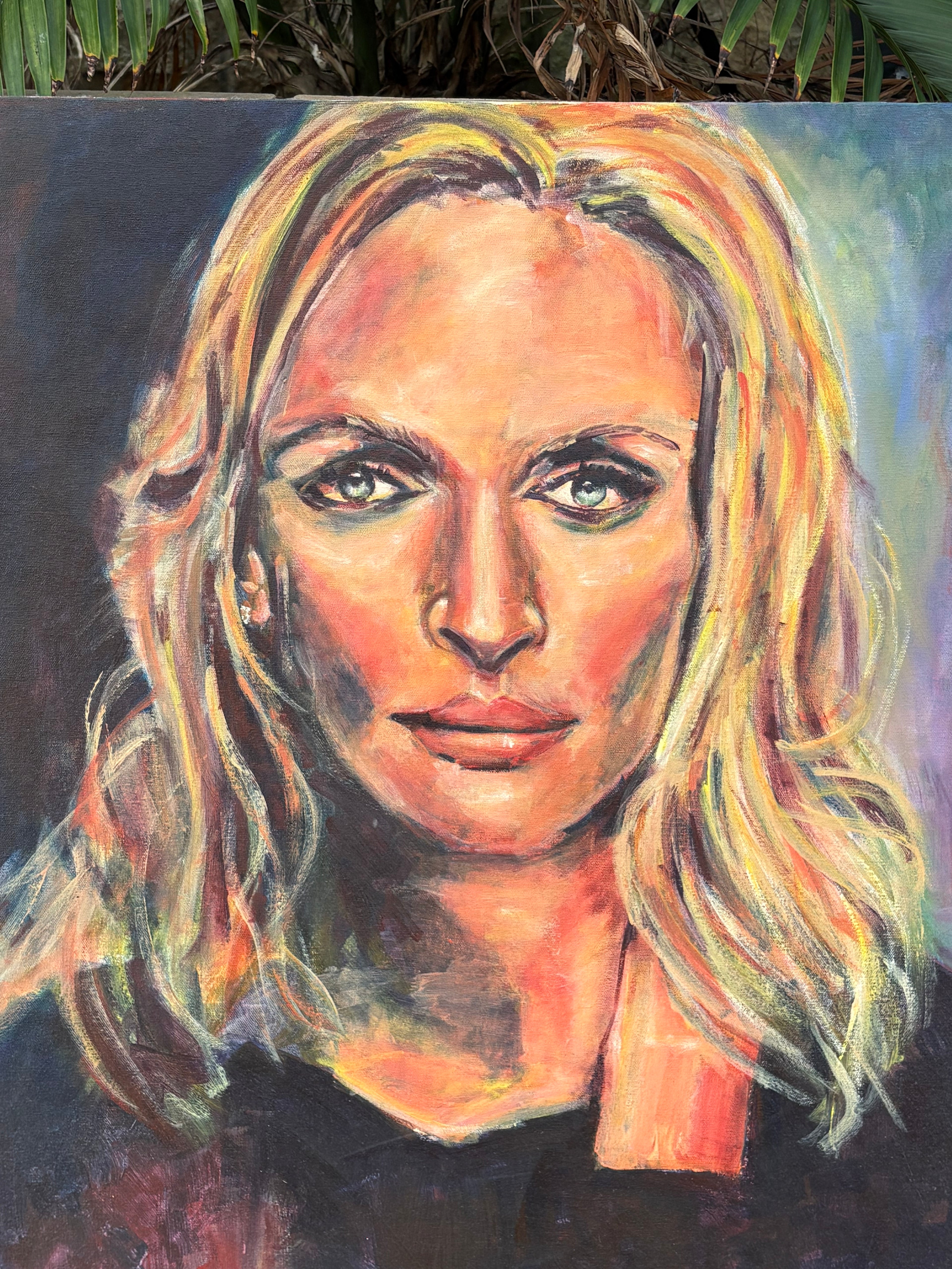 A hand-painted portrait of a strong, blonde-haired woman with expressive eyes, created with bold brushstrokes and vibrant colours, conveying depth and emotion.