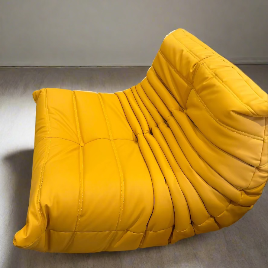 Yellow and pink lounge chairs in a room with colorful decor