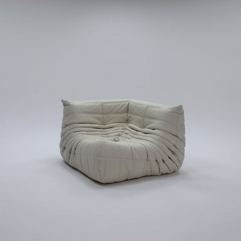 White textured sofa in a minimal white room